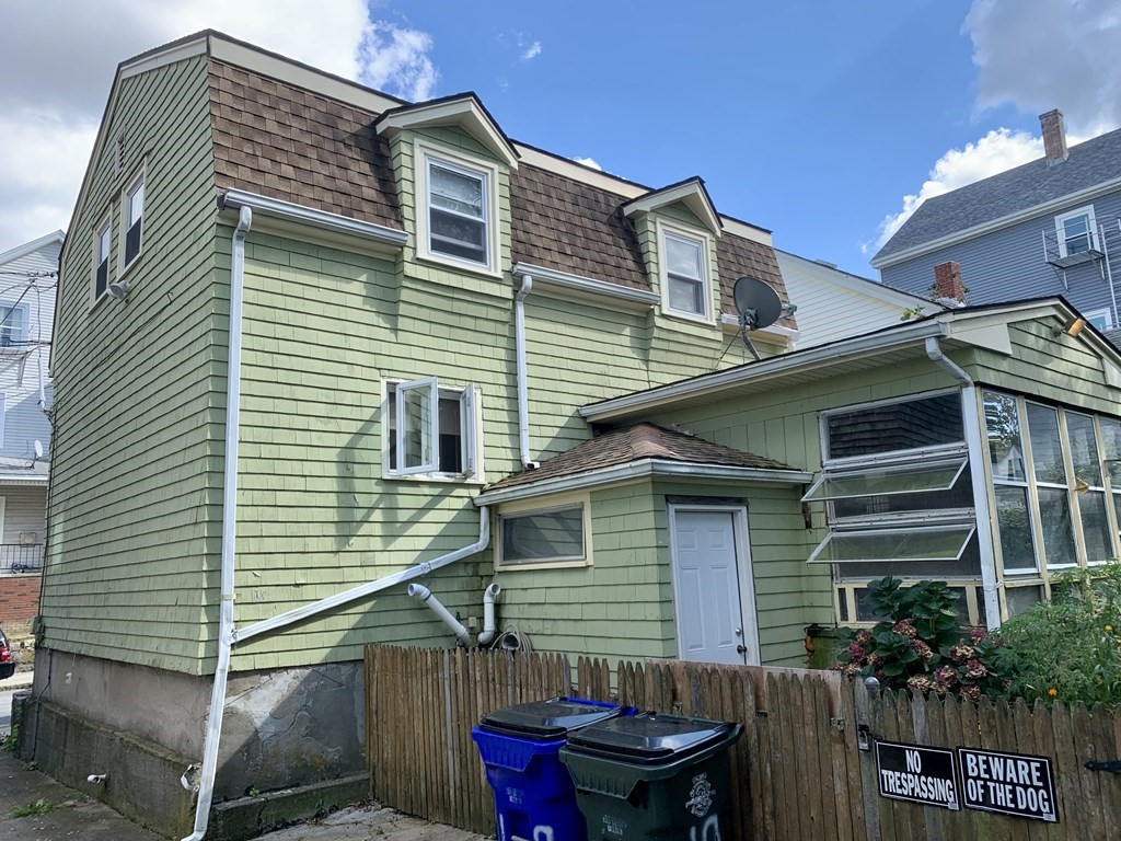 19 Beacon Street Fall River, MA 02721 - Photo 6 of 33 a view of house with a chairs and table in a patio
