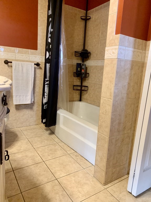 19 Beacon Street Fall River, MA 02721 - Photo 8 of 33 a bathroom with a tub and shower