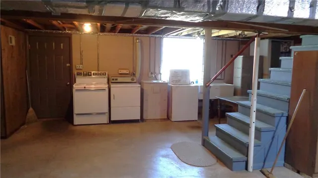 a bed room with furniture and a window