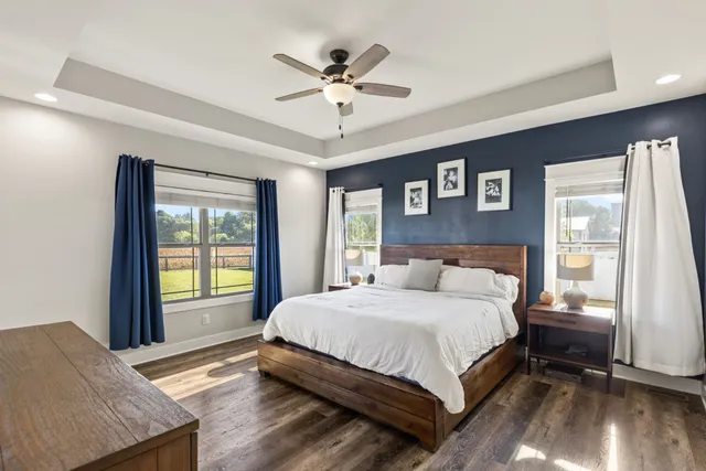 a bedroom with a large bed and a window