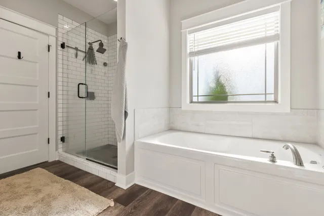 a bathroom with a bathtub and shower