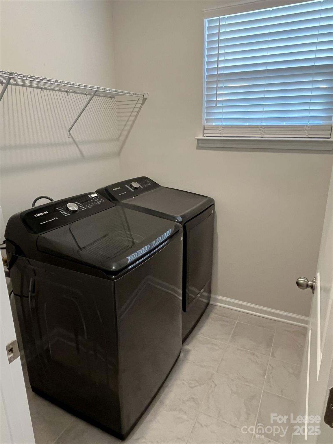15529 Capps Road Charlotte, NC 28278 - Photo 12 of 27 a utility room with cabinets and a window