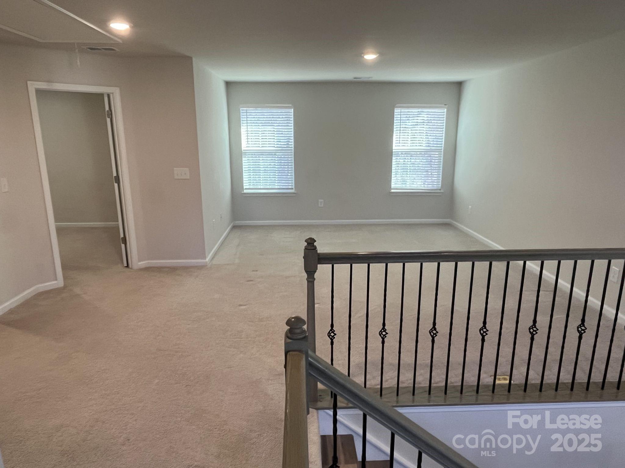 15529 Capps Road Charlotte, NC 28278 - Photo 13 of 27 a view of staircase with window and stairs