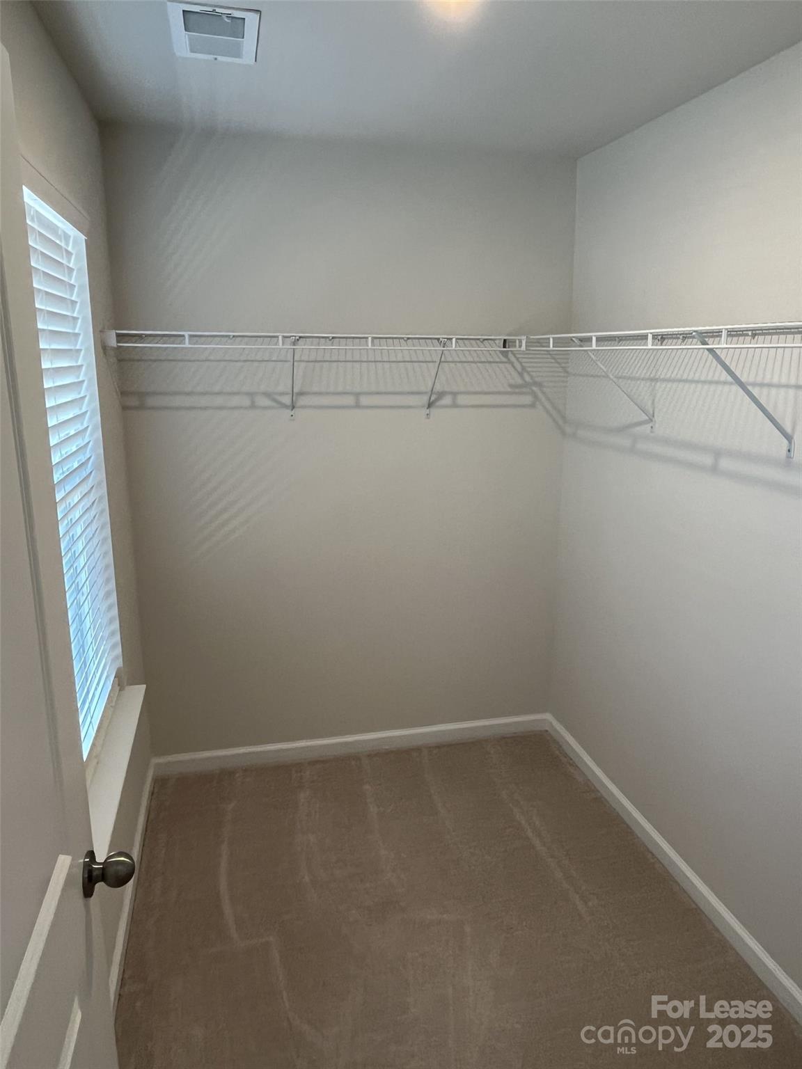 15529 Capps Road Charlotte, NC 28278 - Photo 16 of 27 a view of a room with racks on the wall