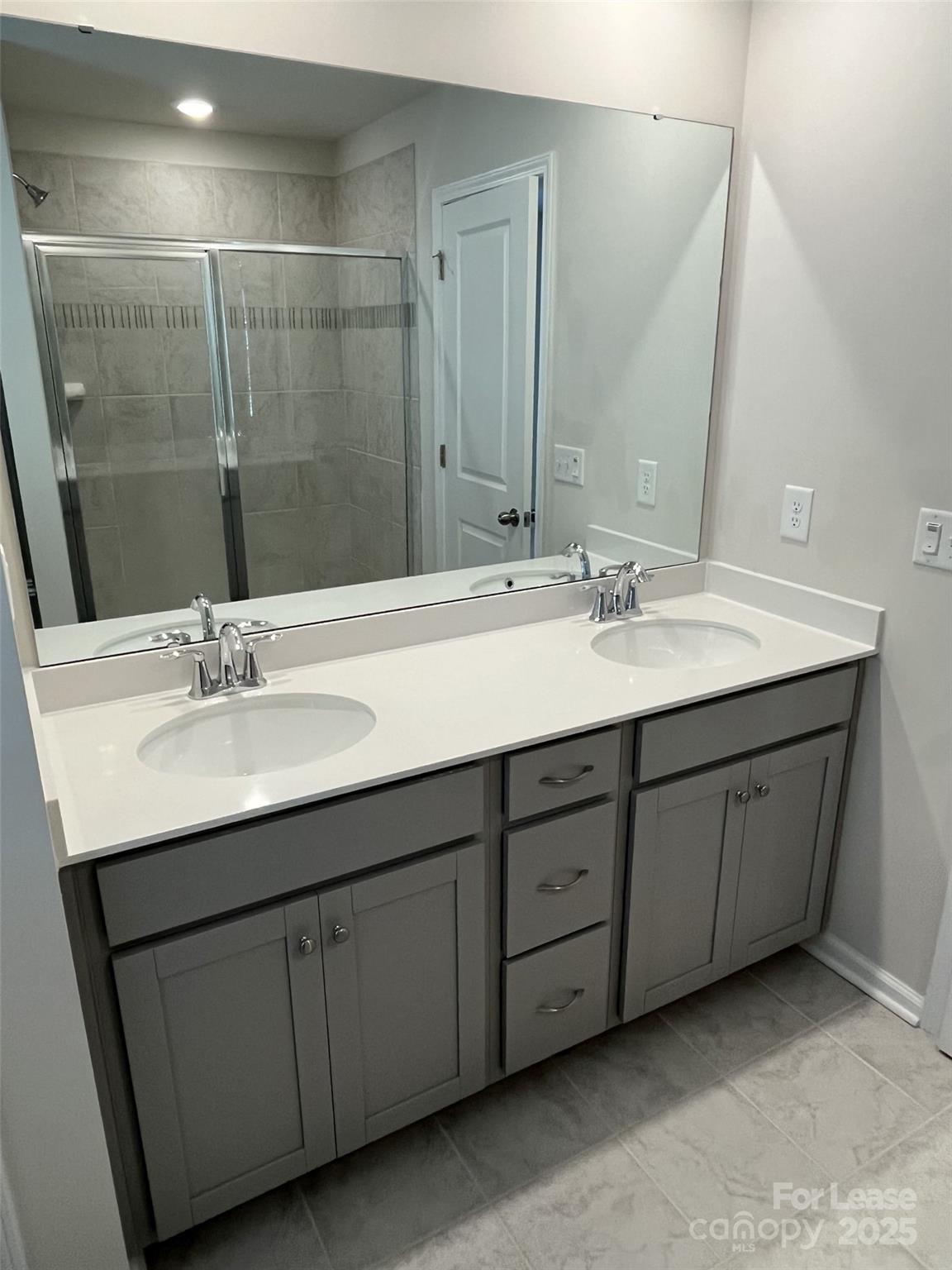 15529 Capps Road Charlotte, NC 28278 - Photo 17 of 27 a bathroom with a double vanity sink and a mirror