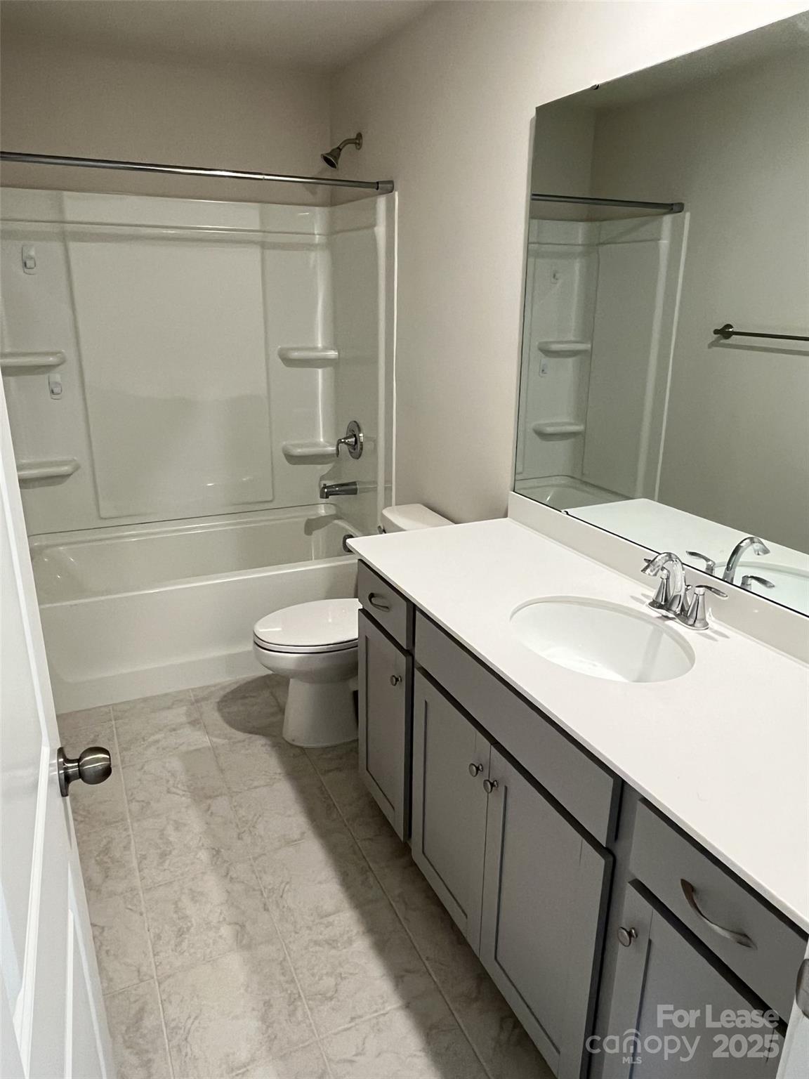 15529 Capps Road Charlotte, NC 28278 - Photo 23 of 27 a bathroom with a double vanity sink toilet mirror and shower