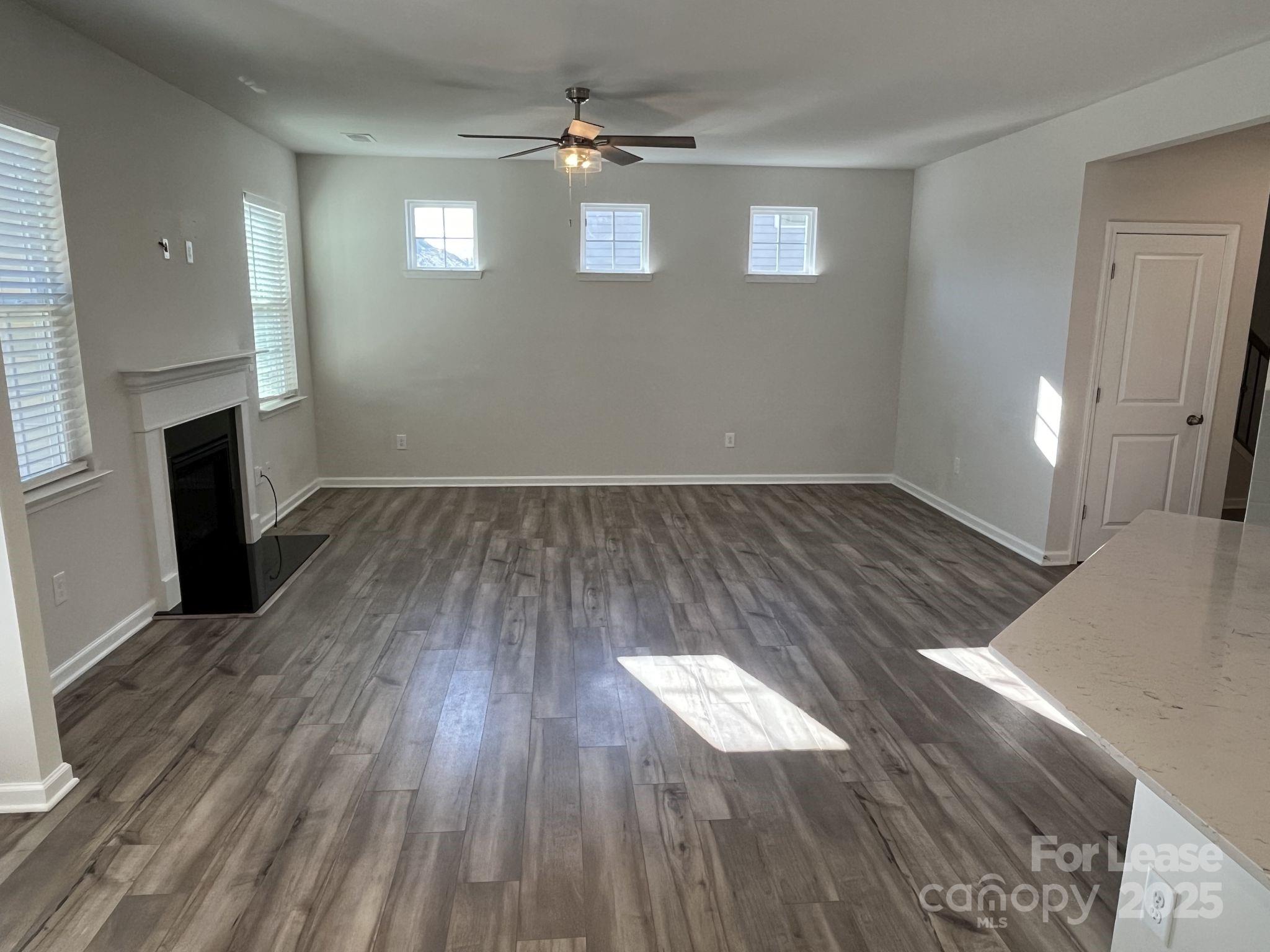 15529 Capps Road Charlotte, NC 28278 - Photo 6 of 27 wooden floor in an empty room with a window