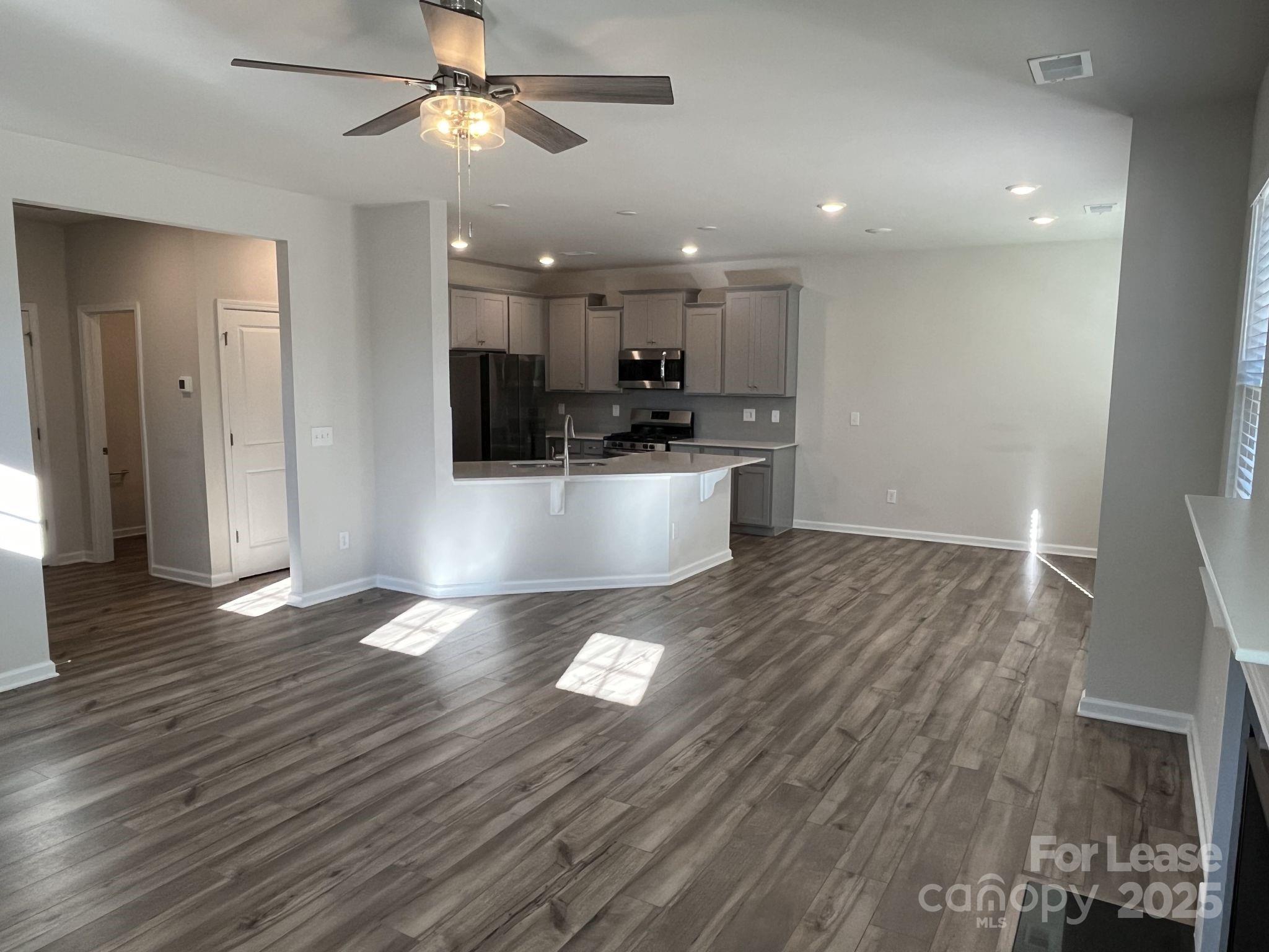 15529 Capps Road Charlotte, NC 28278 - Photo 8 of 27 a view of a kitchen with a sink and microwave