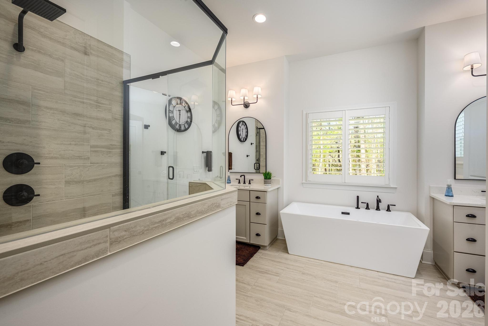 2411 Callaghan Court Landis, NC 28088 - Photo 29 of 48 a bathroom with a double vanity sink mirror bathtub and shower