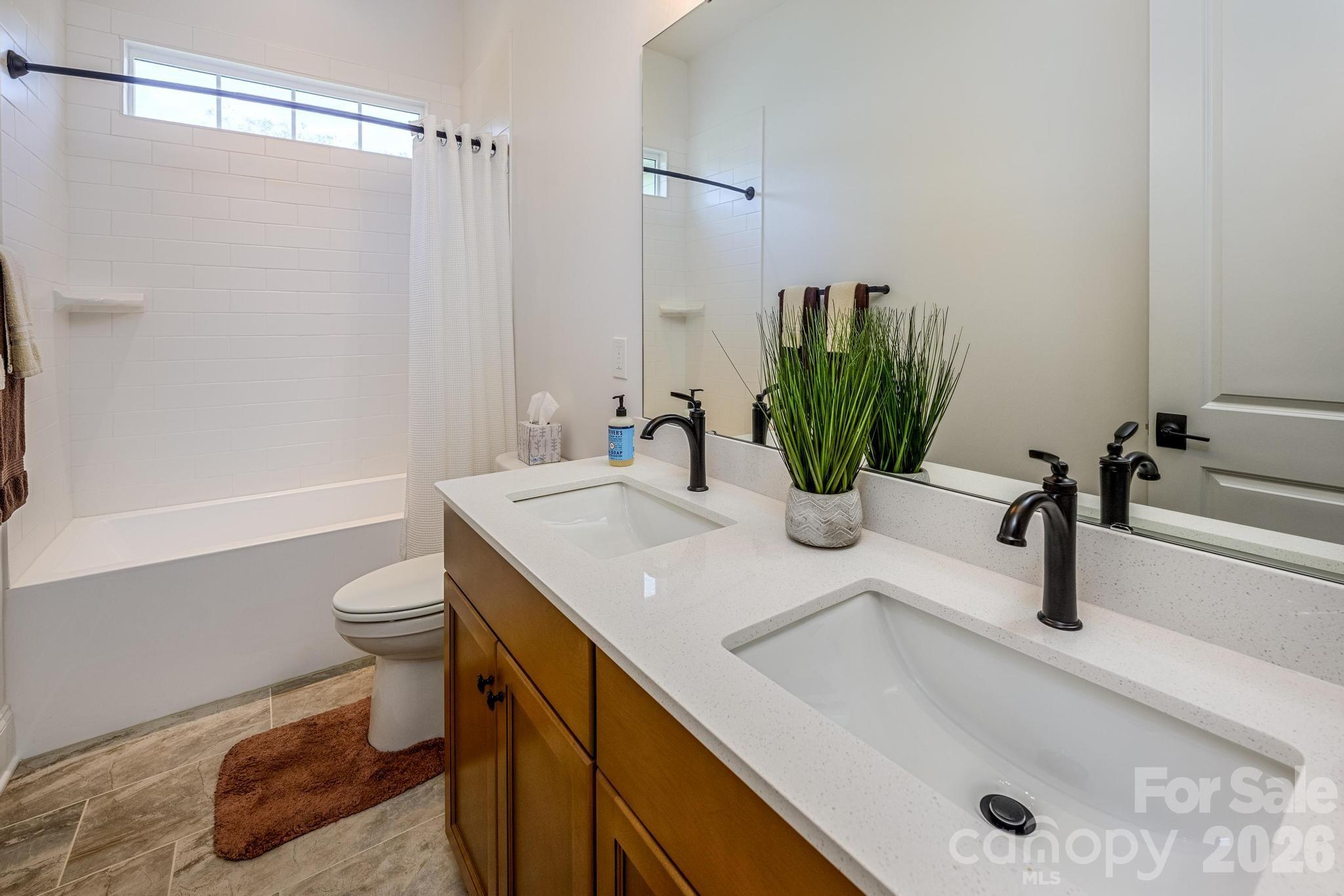 2411 Callaghan Court Landis, NC 28088 - Photo 32 of 48 a bathroom with a sink and a mirror