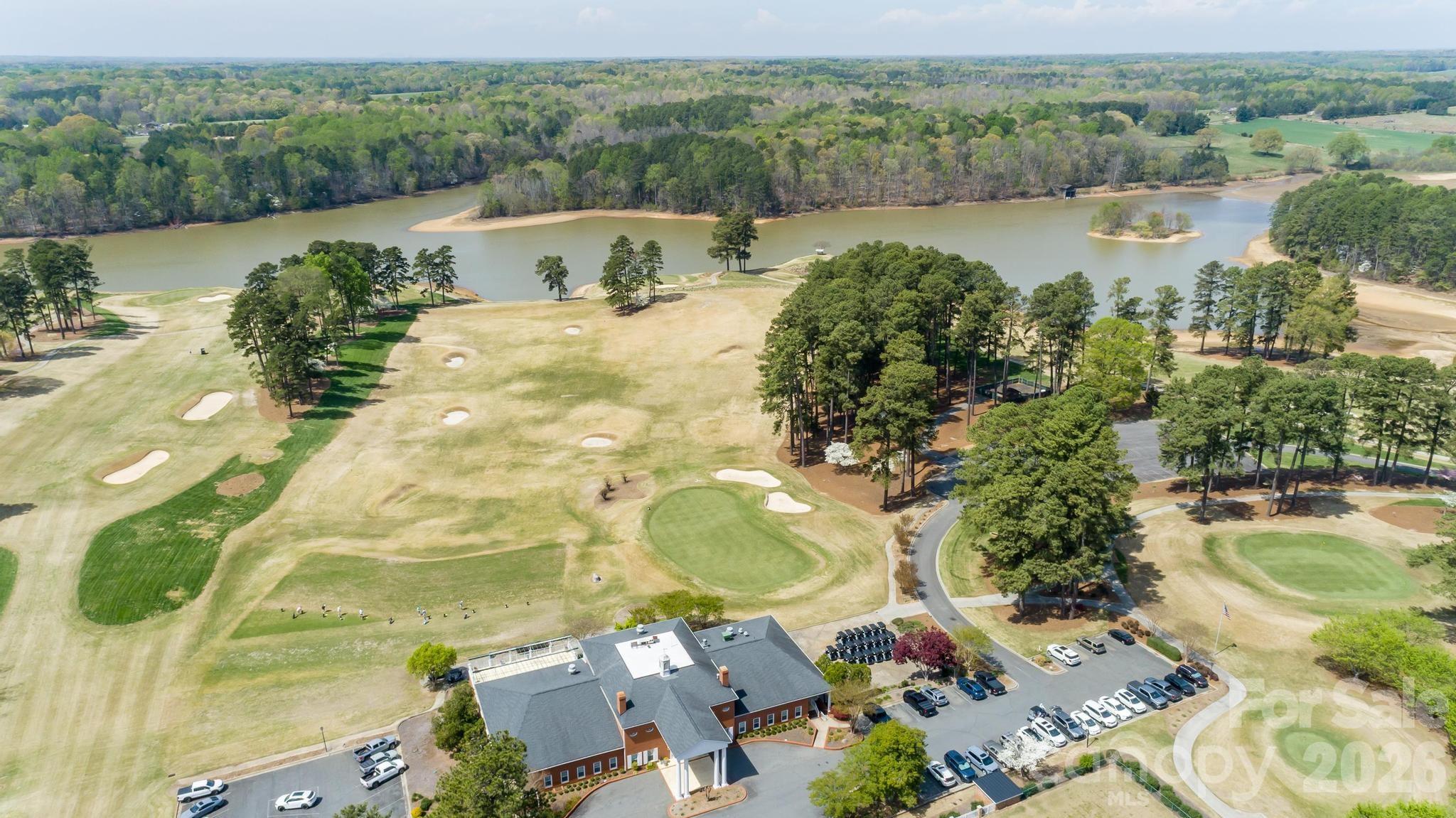 2411 Callaghan Court Landis, NC 28088 - Photo 34 of 48 an aerial view of a house with outdoor space and a lake view