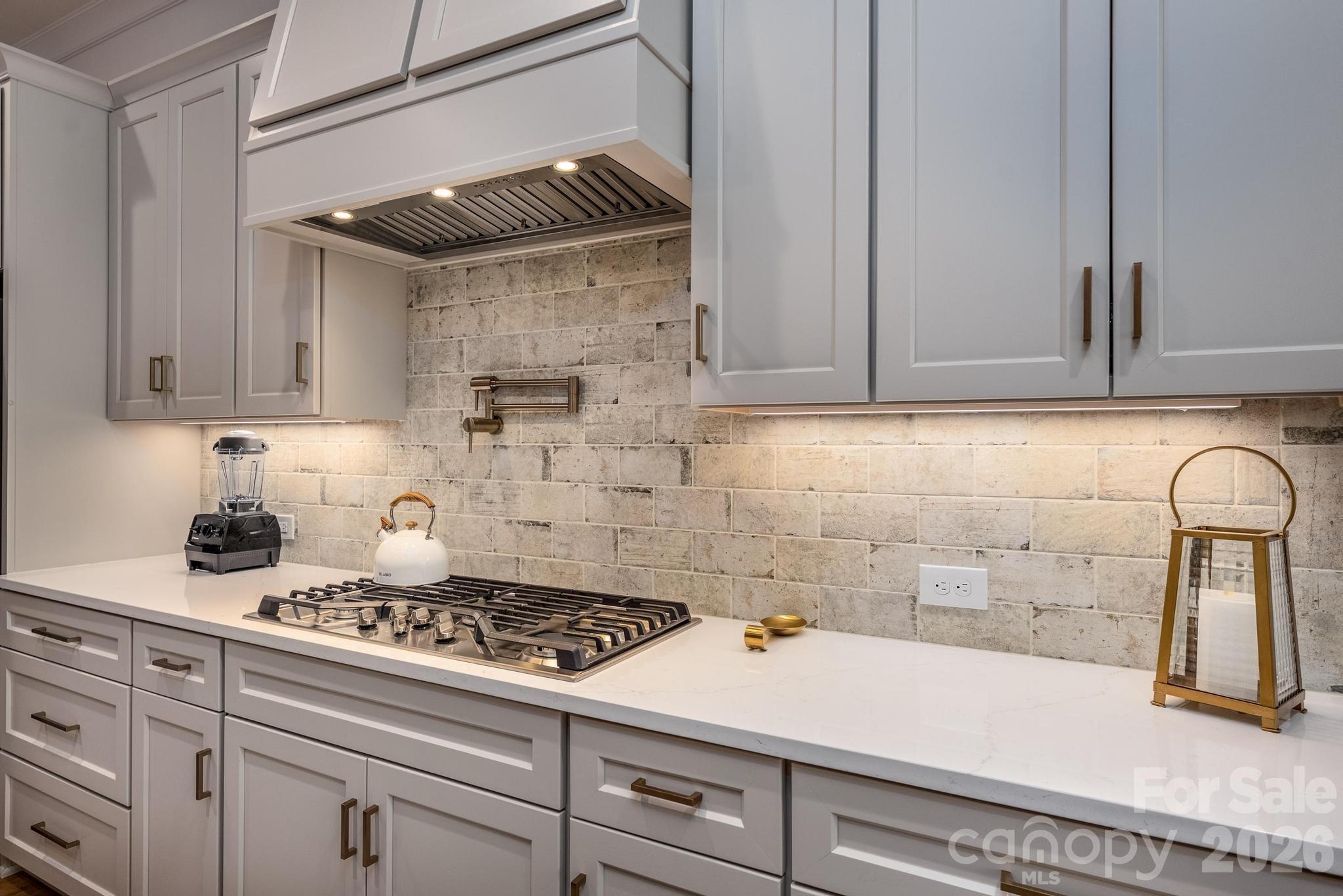 2411 Callaghan Court Landis, NC 28088 - Photo 8 of 48 a kitchen with a stove and cabinets