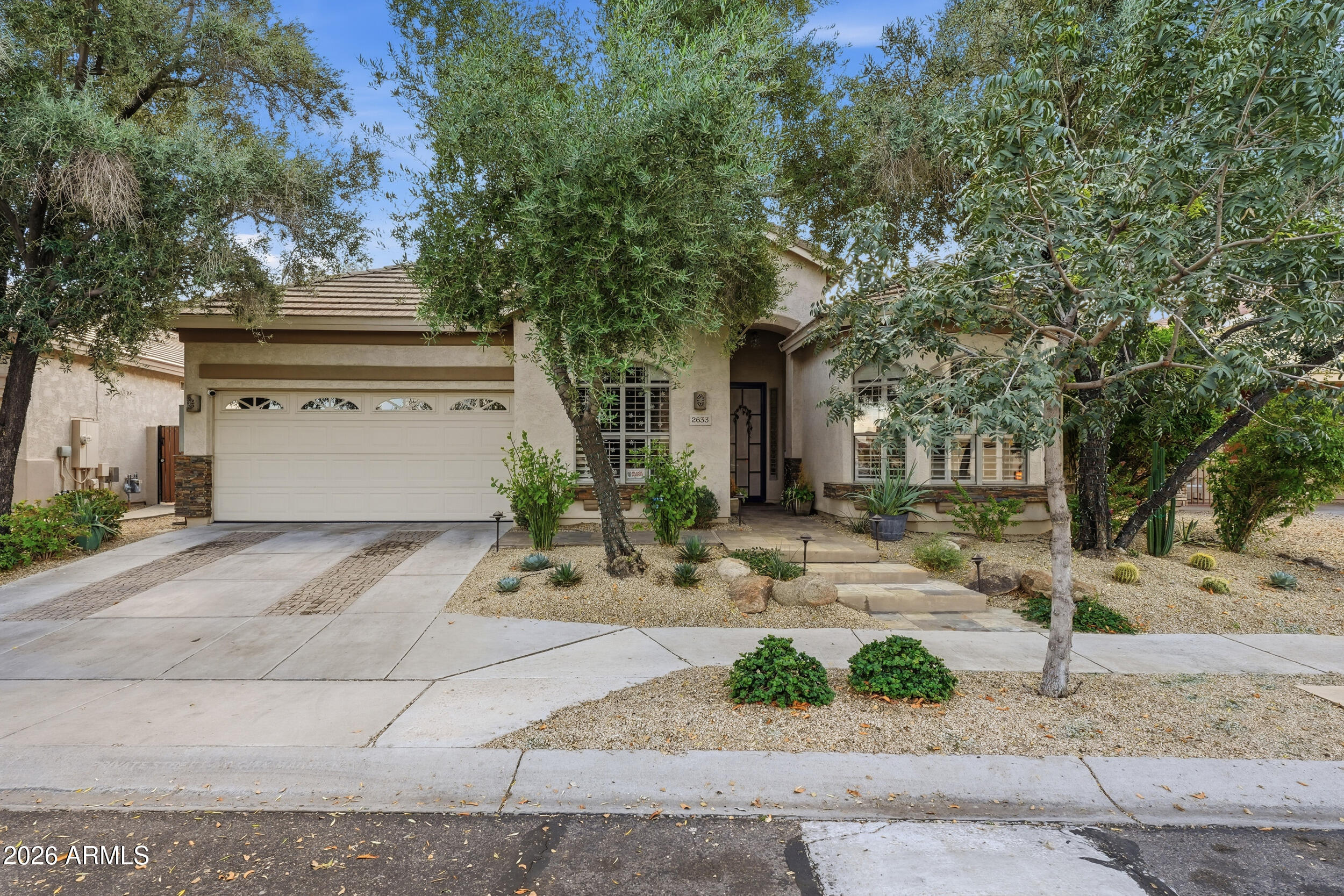 2633 East Fremont Road Phoenix, AZ 85042 - Photo 1 of 43 a front view of a house with a yard and garage