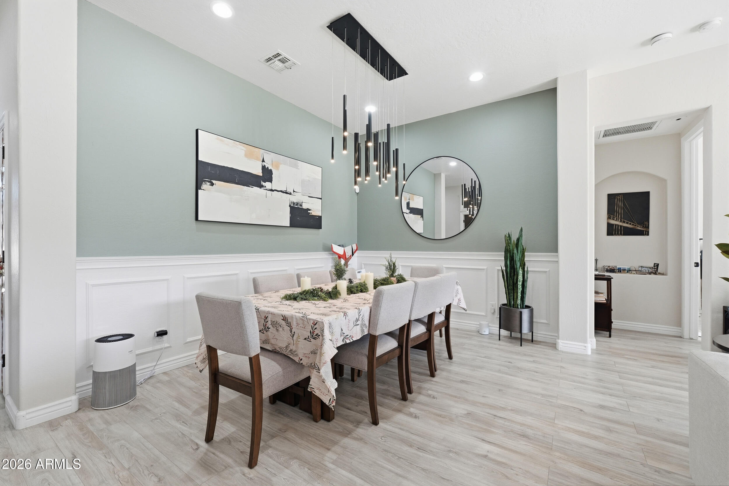2633 East Fremont Road Phoenix, AZ 85042 - Photo 12 of 43 a view of a dining room with furniture and wooden floor