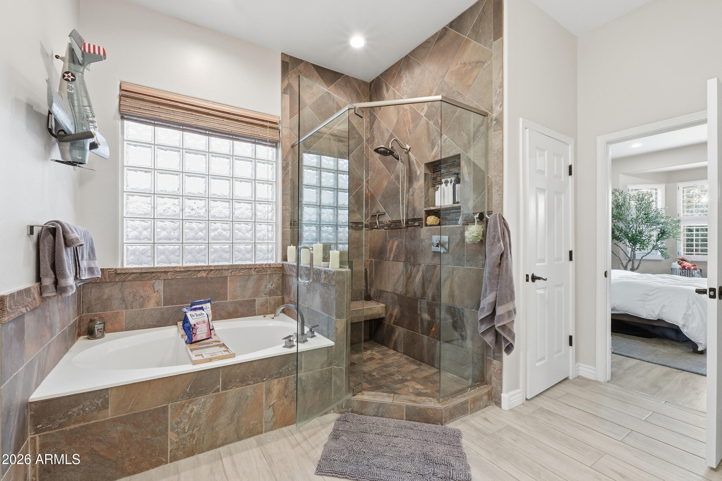 2633 East Fremont Road Phoenix, AZ 85042 - Photo 22 of 43 a bathroom with a tub shower and sink