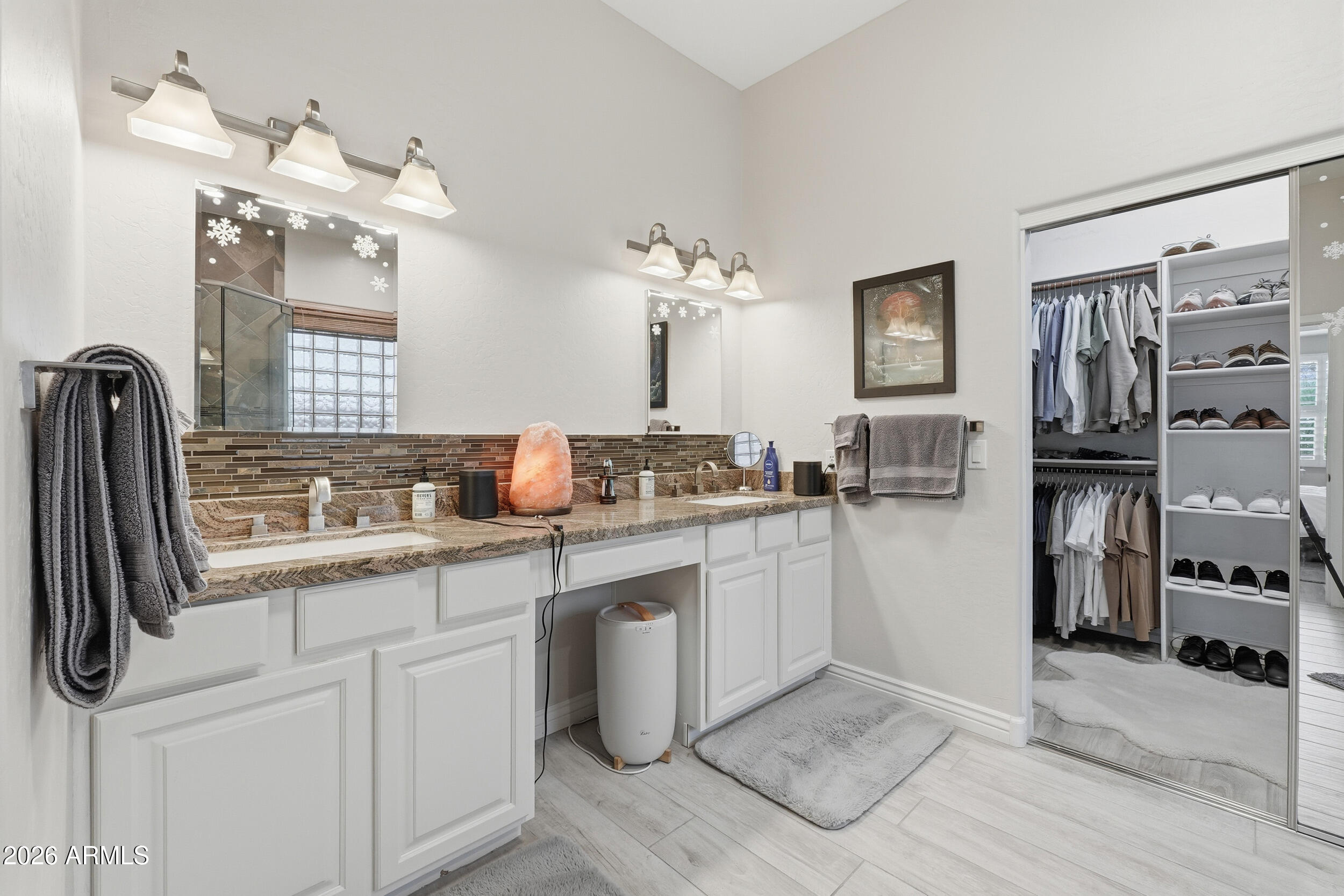 2633 East Fremont Road Phoenix, AZ 85042 - Photo 25 of 43 a spacious bathroom with a sink a mirror and a shower