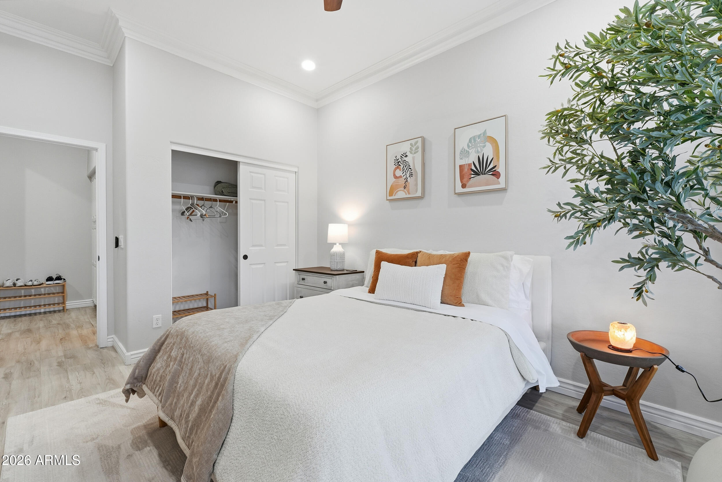 2633 East Fremont Road Phoenix, AZ 85042 - Photo 29 of 43 a bedroom with a bed and a chair