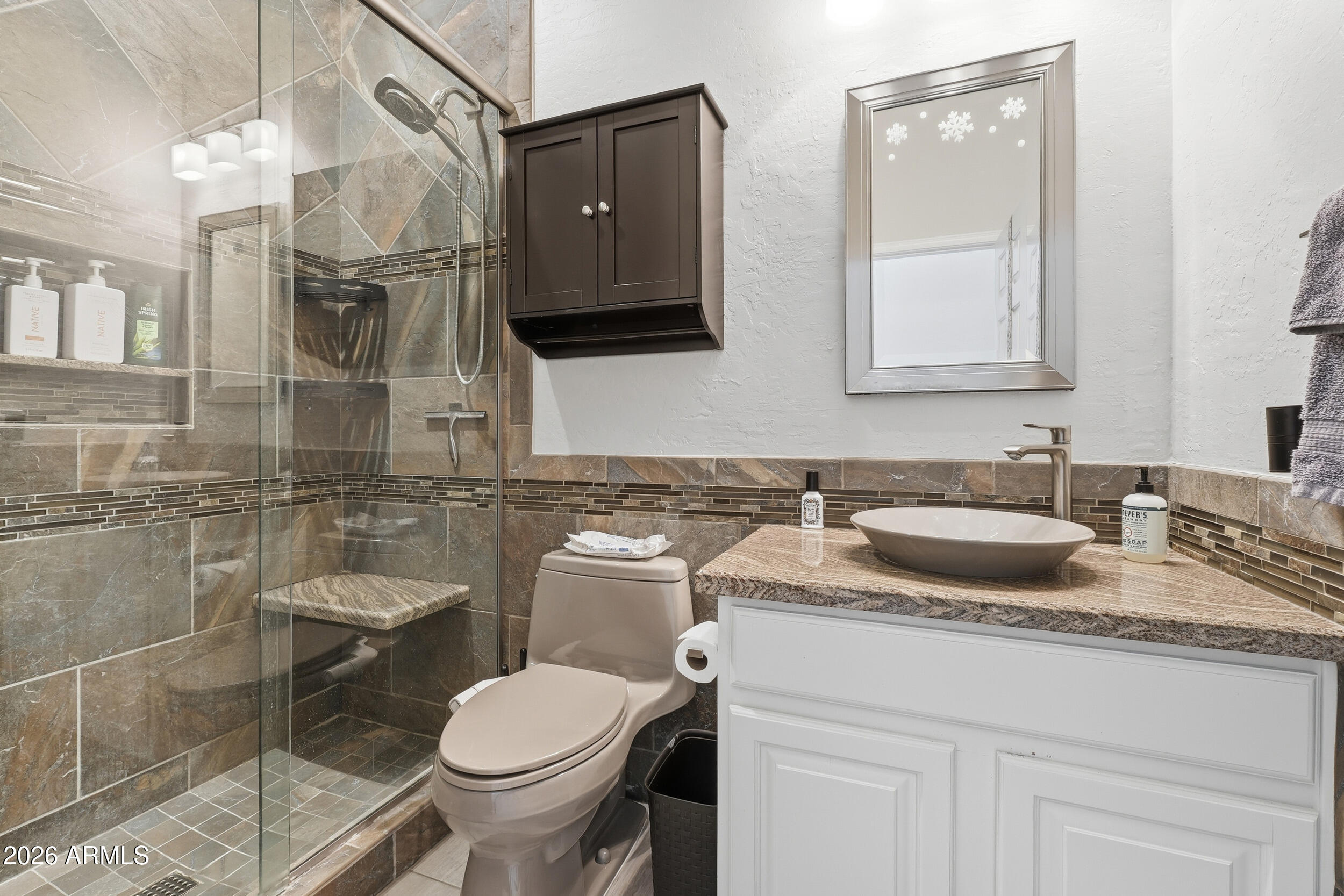 2633 East Fremont Road Phoenix, AZ 85042 - Photo 30 of 43 a bathroom with a granite countertop toilet sink and mirror