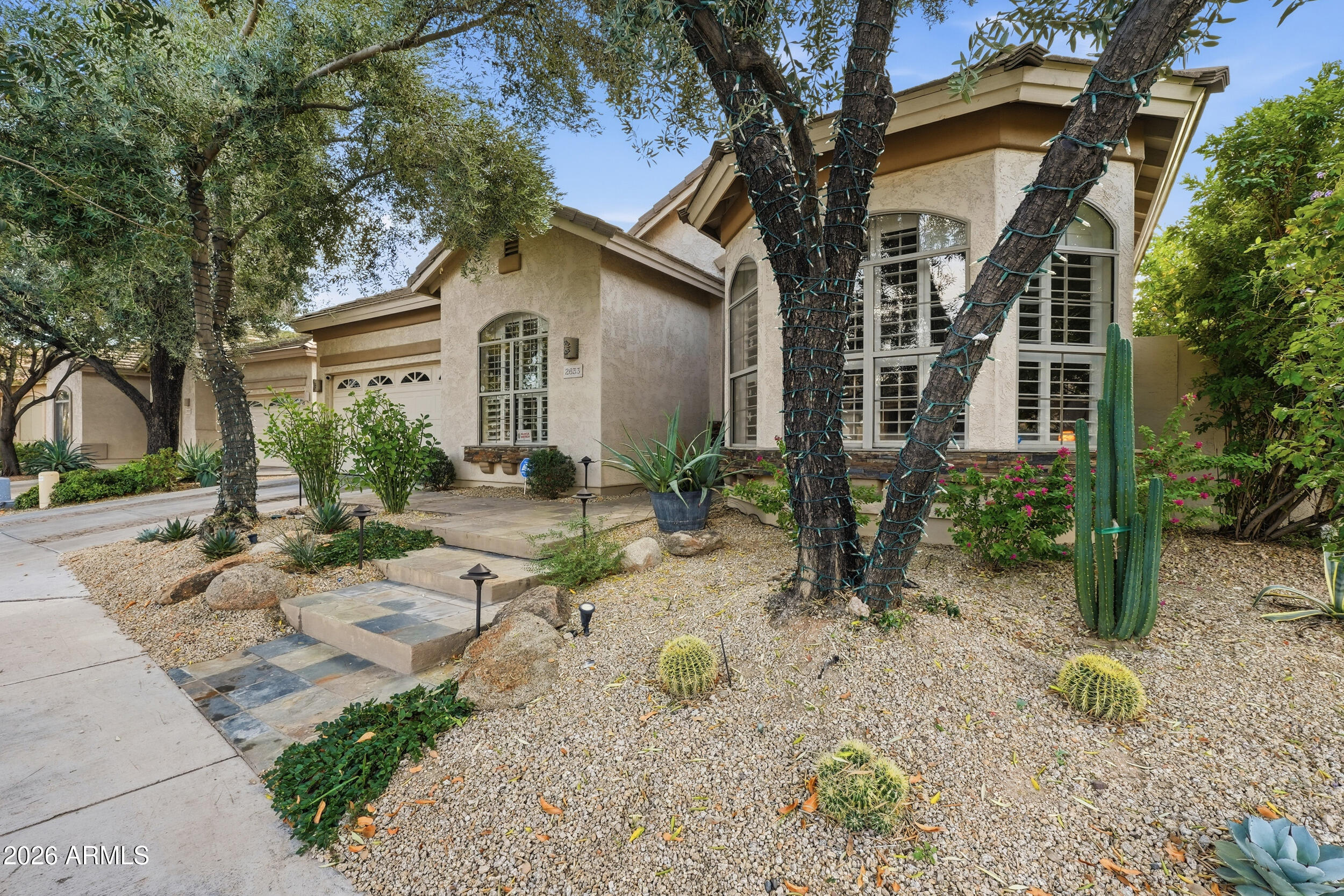 2633 East Fremont Road Phoenix, AZ 85042 - Photo 5 of 43 a front view of a house with garden