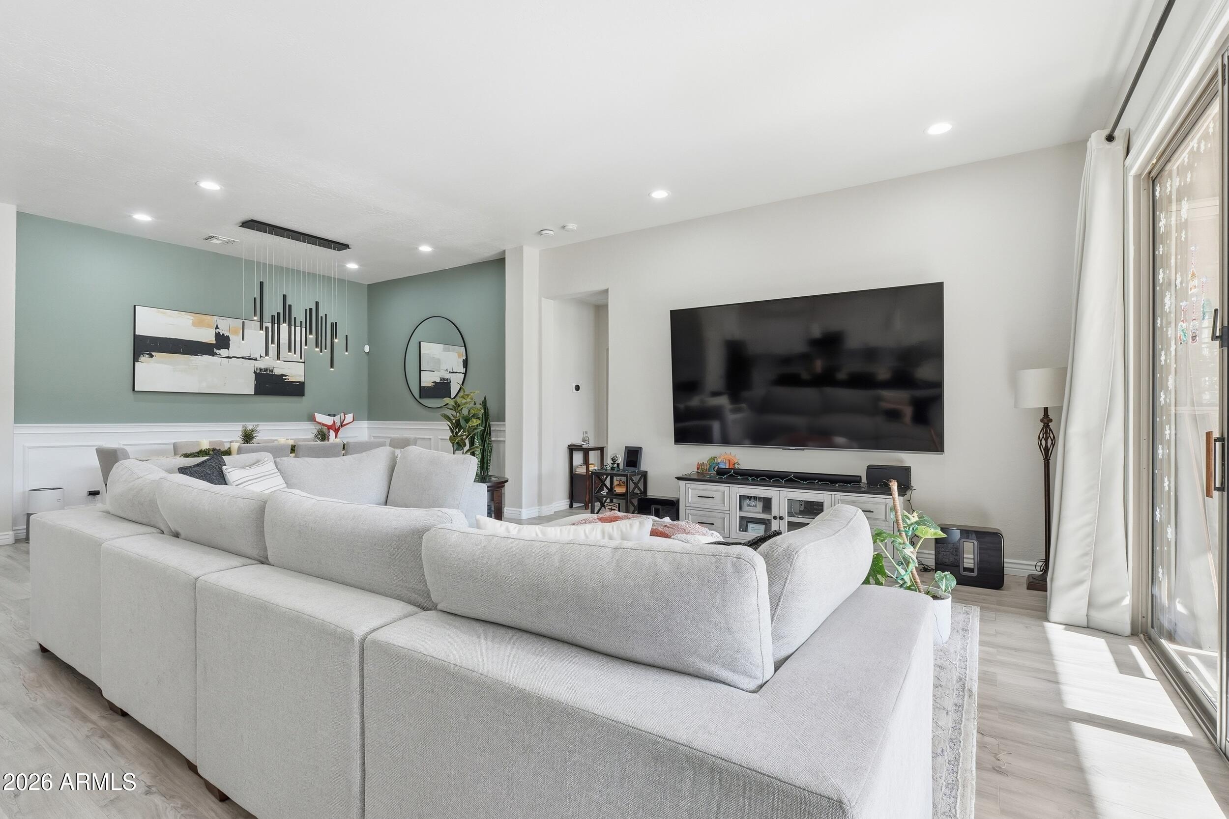 2633 East Fremont Road Phoenix, AZ 85042 - Photo 8 of 43 a living room with furniture and a flat screen tv