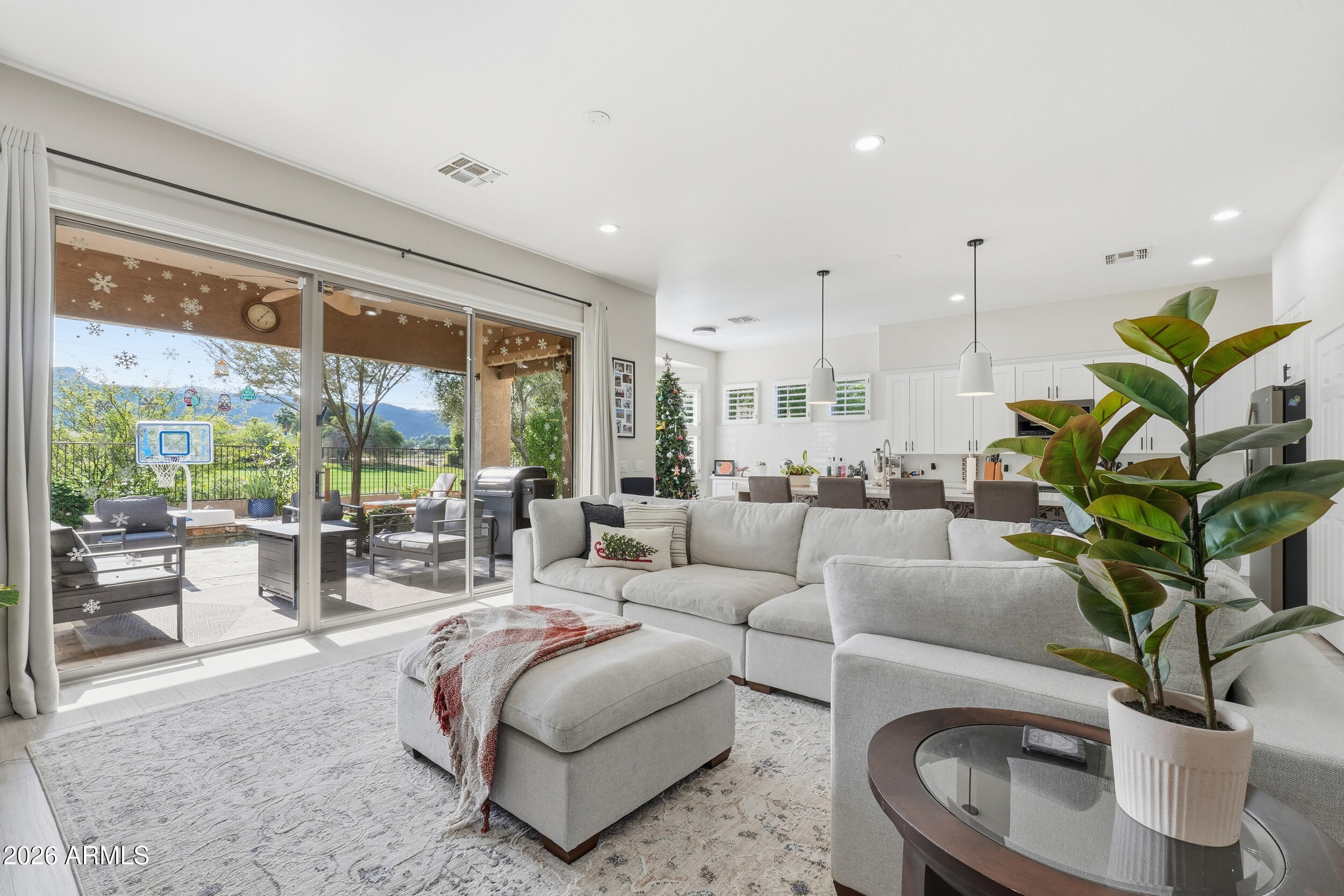 2633 East Fremont Road Phoenix, AZ 85042 - Photo 9 of 43 a living room with furniture large windows and plants