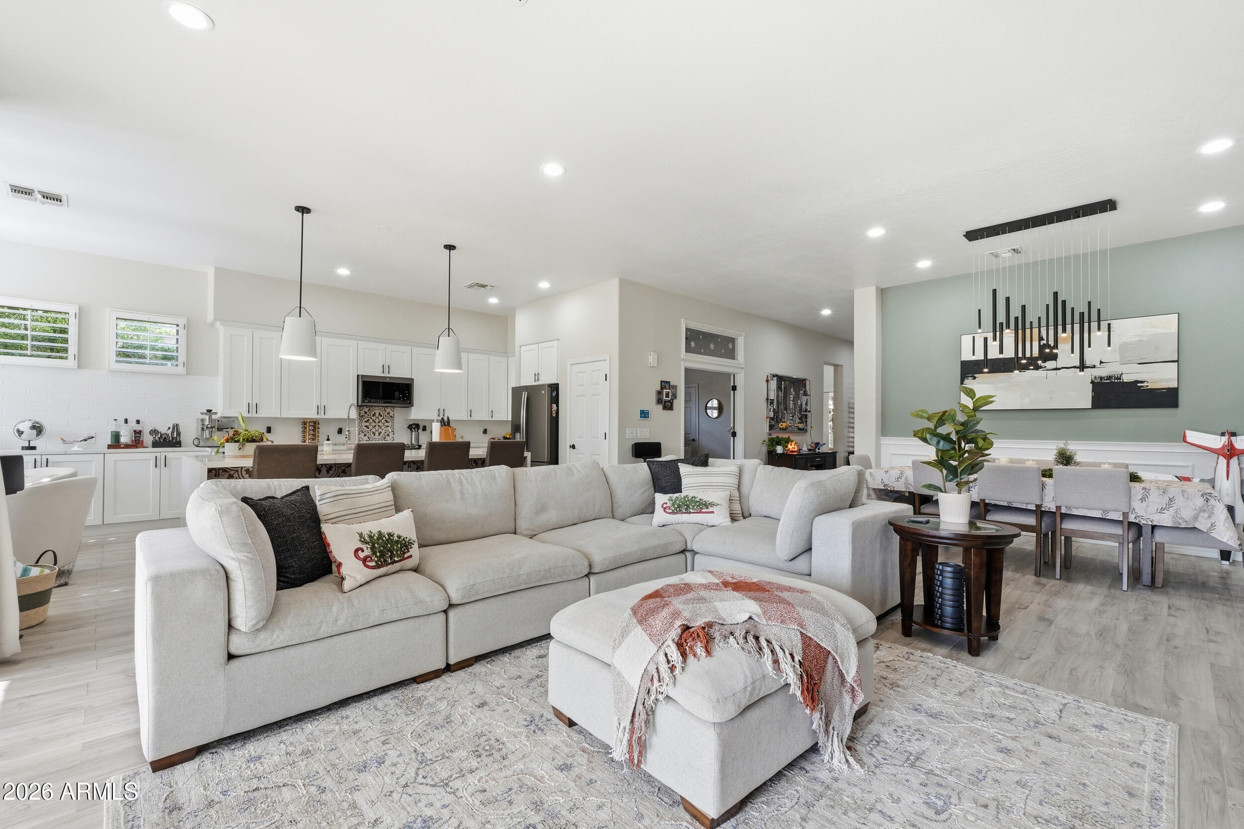2633 East Fremont Road Phoenix, AZ 85042 - Photo 10 of 43 a living room with furniture white walls and kitchen view