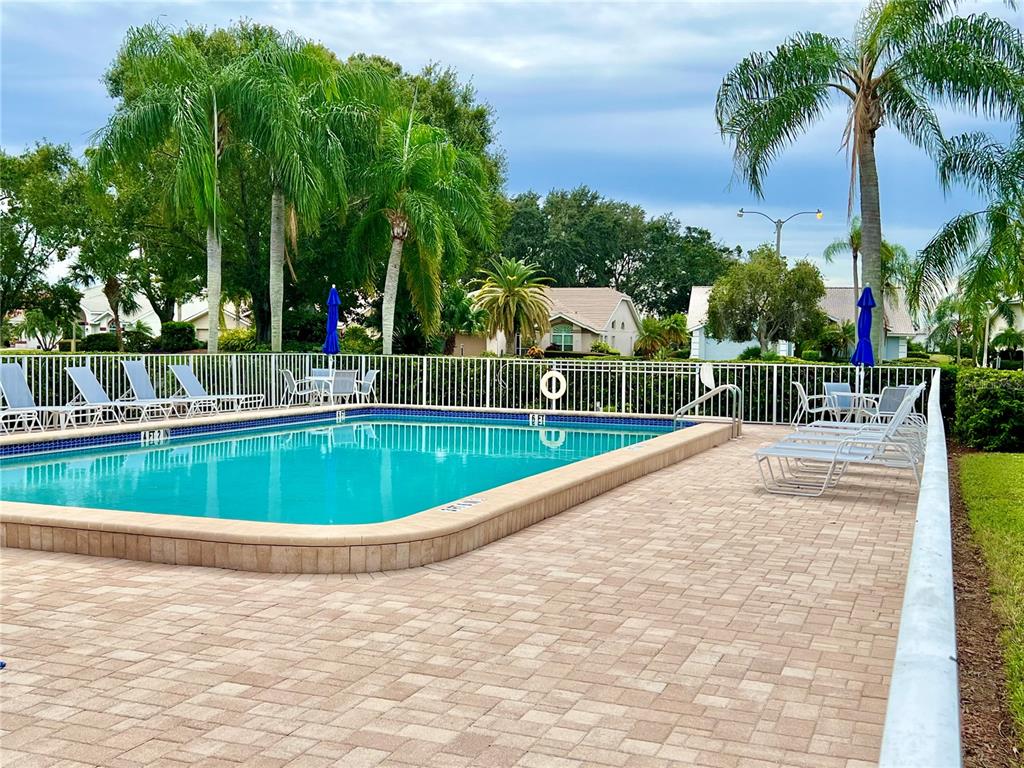 6501 Stone River Road, Unit 203 Bradenton, FL 34203 - Photo 13 of 45 a view of a swimming pool with a patio