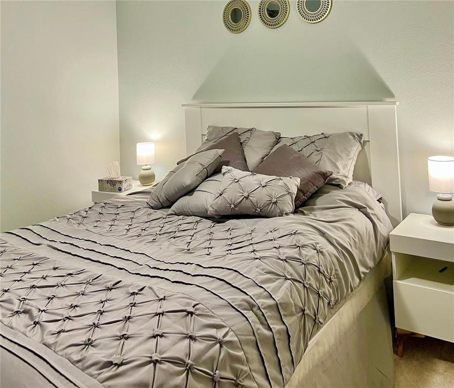 6501 Stone River Road, Unit 203 Bradenton, FL 34203 - Photo 17 of 45 a bedroom with a bed and a window