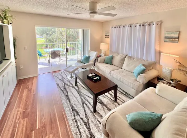 a living room with furniture and a large window