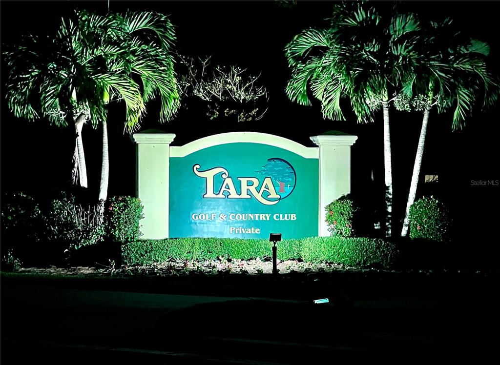 6501 Stone River Road, Unit 203 Bradenton, FL 34203 - Photo 33 of 45 a sign that is sitting in front of flowers