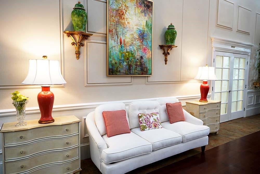 6501 Stone River Road, Unit 203 Bradenton, FL 34203 - Photo 38 of 45 a living room with furniture and a potted plant