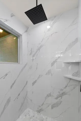 a bathroom with a sink double vanity and a mirror