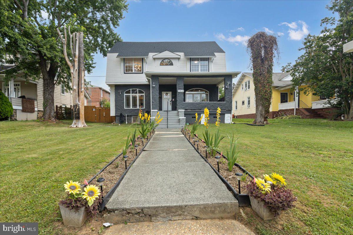 3910 Chatham Road Baltimore, MD 21207 - Photo 1 of 71 a front view of a house with garden