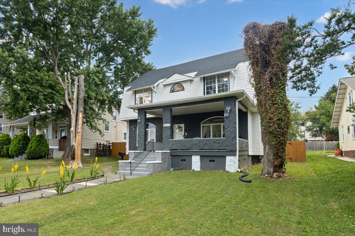3910 Chatham Road Baltimore, MD 21207 - Photo 2 of 71 a front view of a house with a garden