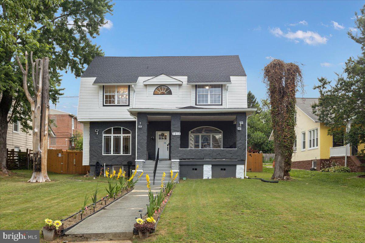 3910 Chatham Road Baltimore, MD 21207 - Photo 3 of 71 a front view of a house with a yard