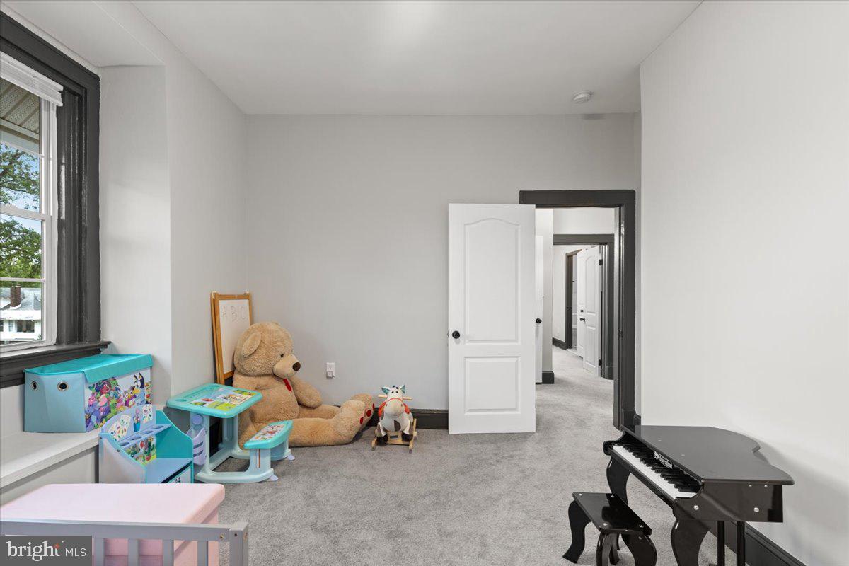 3910 Chatham Road Baltimore, MD 21207 - Photo 31 of 71 a living room with furniture and a window