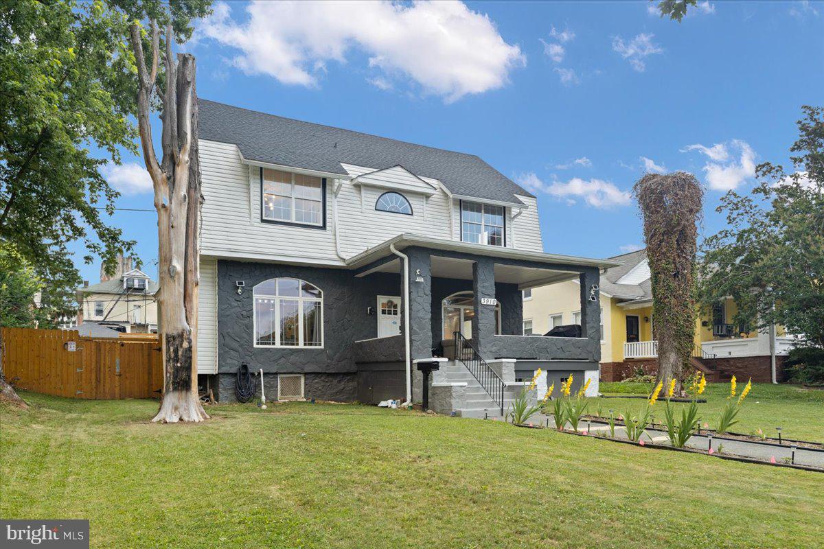 3910 Chatham Road Baltimore, MD 21207 - Photo 4 of 71 a front view of a house with a yard table and chairs