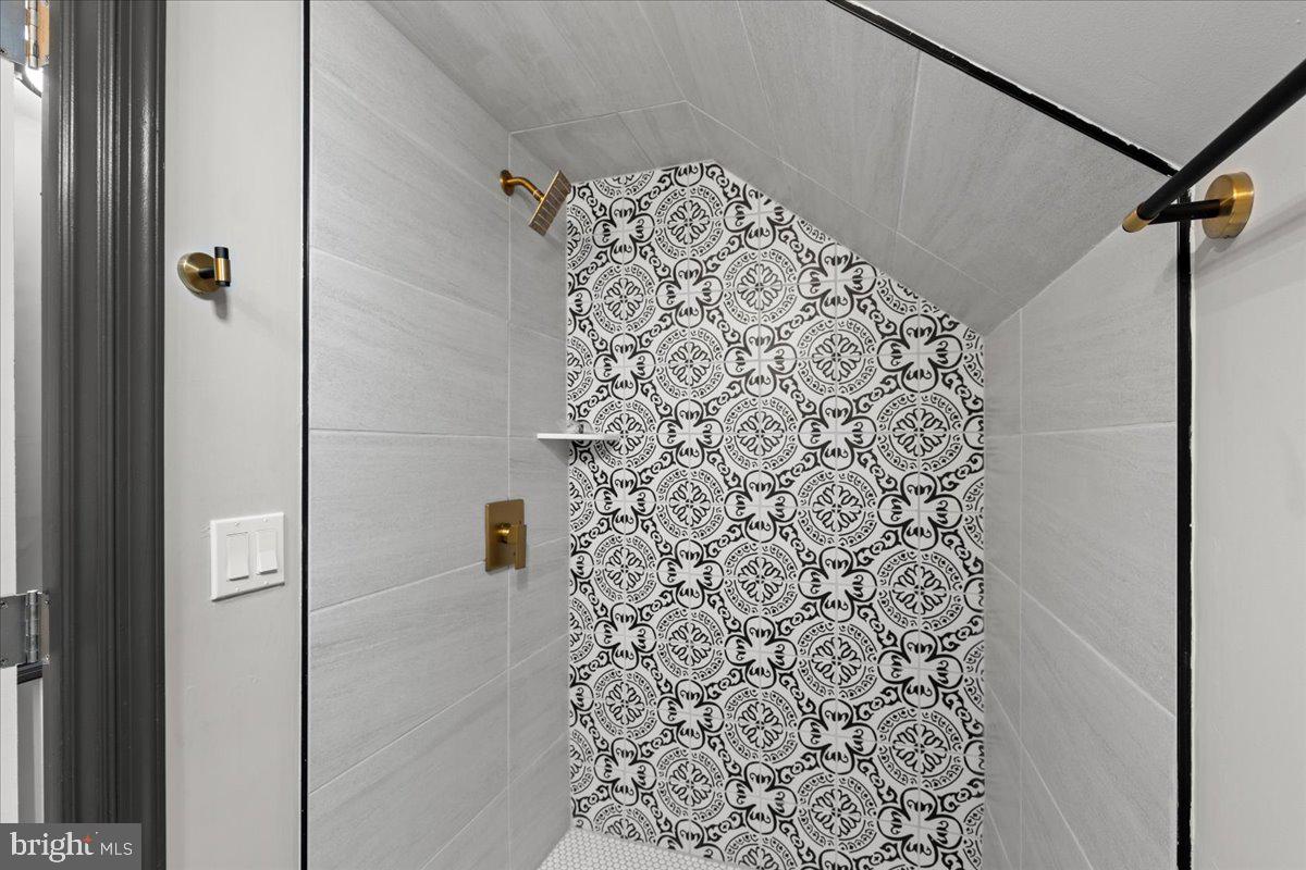 3910 Chatham Road Baltimore, MD 21207 - Photo 47 of 71 a bathroom with a shower curtain