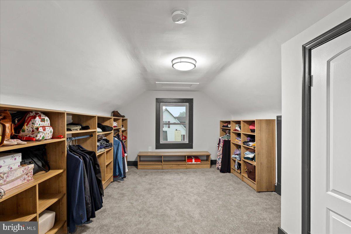 3910 Chatham Road Baltimore, MD 21207 - Photo 48 of 71 a view of walk in closet with clothes and shoes