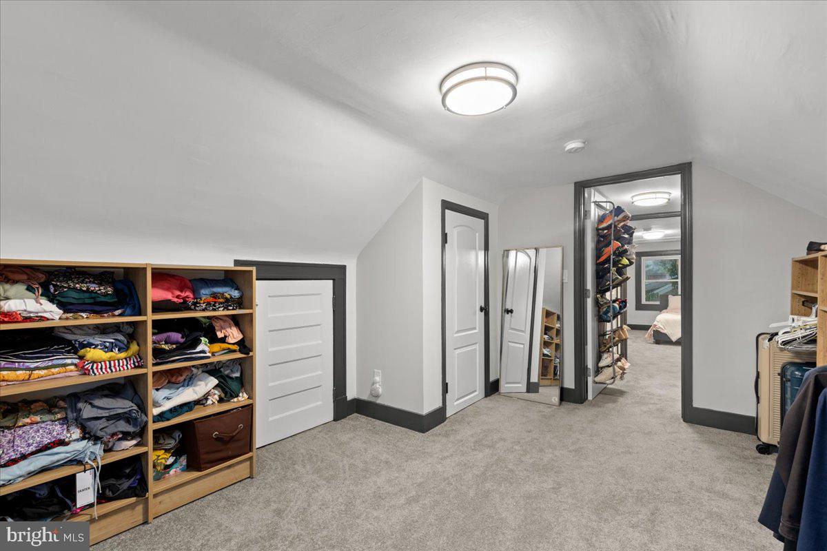 3910 Chatham Road Baltimore, MD 21207 - Photo 49 of 71 a view of walk in closet with clothes and shoes