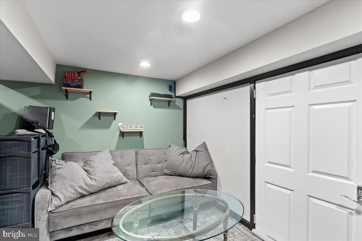 3910 Chatham Road Baltimore, MD 21207 - Photo 50 of 71 a living room with furniture and a wooden floor