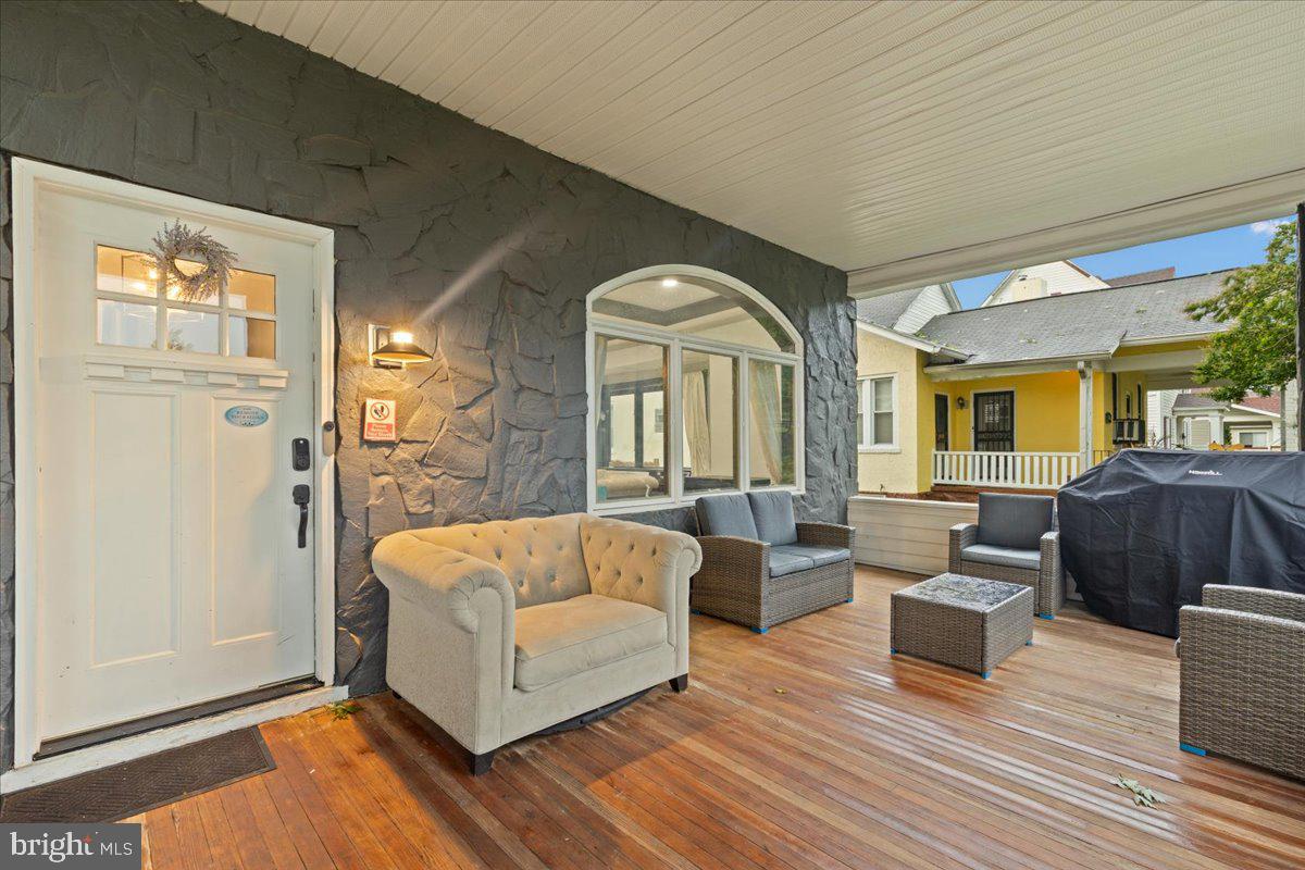3910 Chatham Road Baltimore, MD 21207 - Photo 5 of 71 a living room with furniture and wooden floor