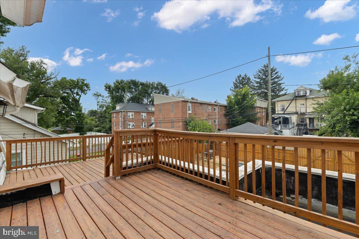 3910 Chatham Road Baltimore, MD 21207 - Photo 59 of 71 a view of balcony with wooden floor and fence