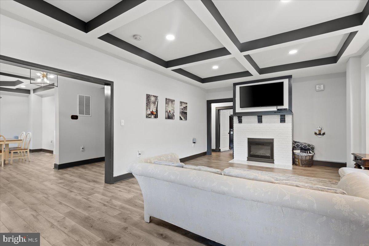 3910 Chatham Road Baltimore, MD 21207 - Photo 9 of 71 a living room with furniture and a flat screen tv