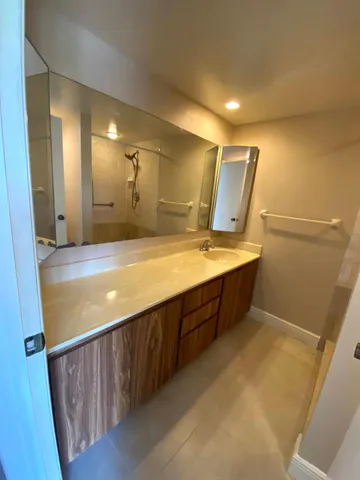 a bathroom with a tub and a shower