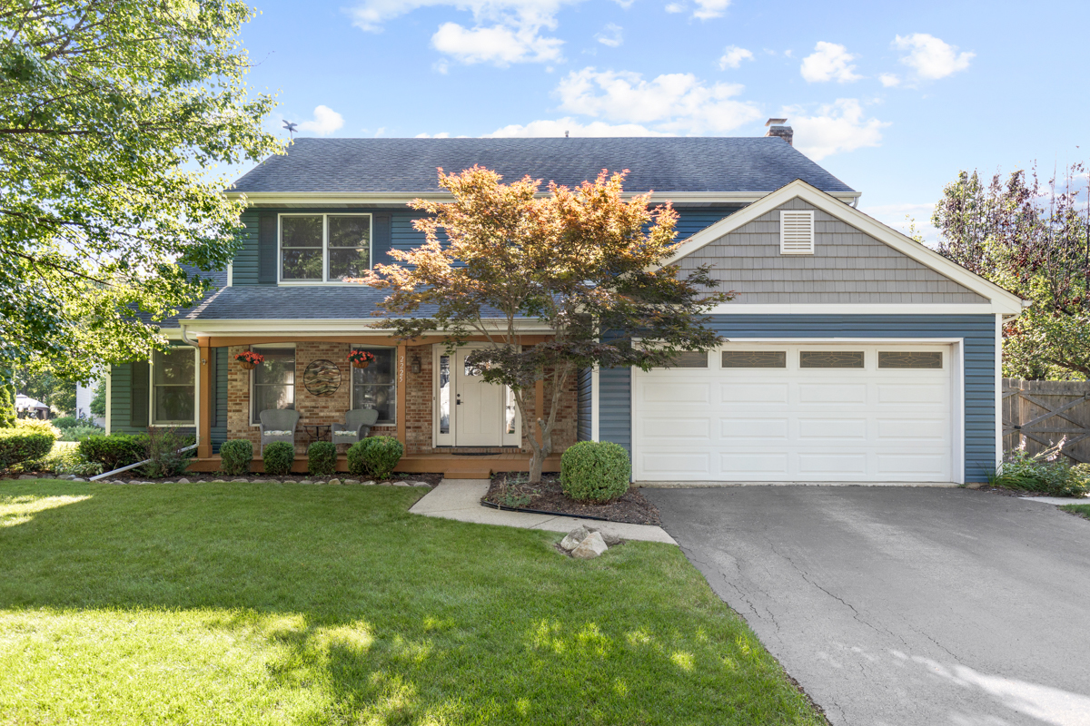 2225 Forest Ridge Road St. Charles, IL 60174 - Photo 1 of 24 a front view of a house with a garden and plants