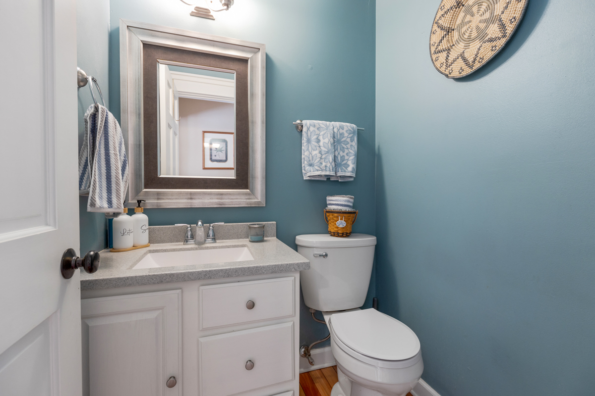 2225 Forest Ridge Road St. Charles, IL 60174 - Photo 12 of 24 a bathroom with a toilet sink vanity and mirror