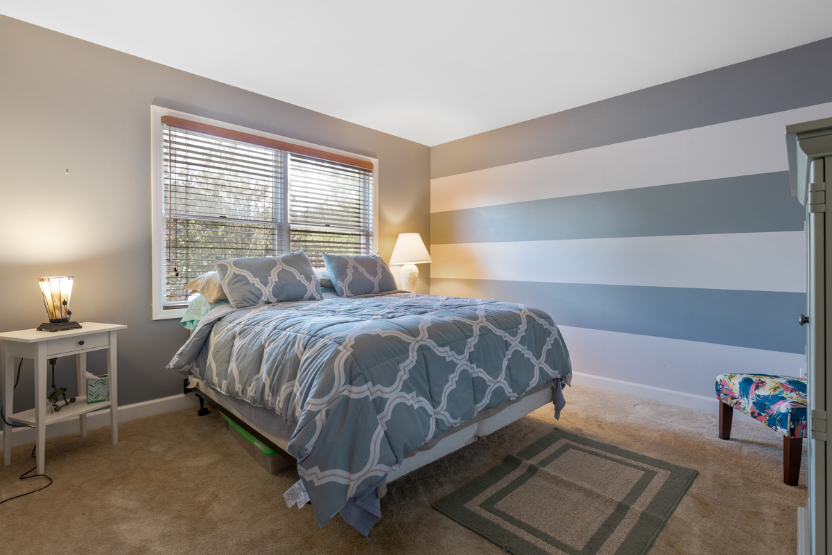 2225 Forest Ridge Road St. Charles, IL 60174 - Photo 17 of 24 a bed sitting in a bedroom next to a window