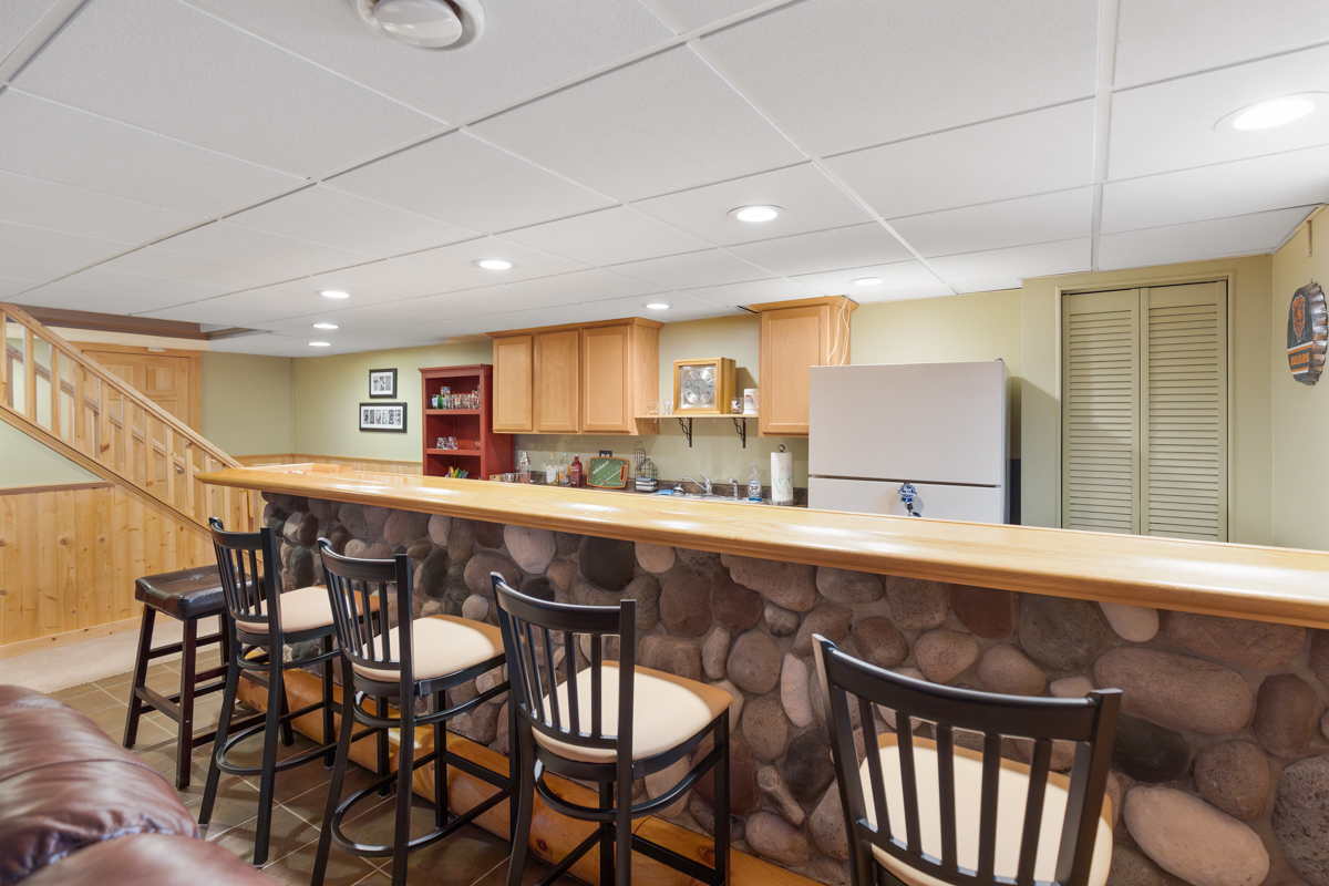 2225 Forest Ridge Road St. Charles, IL 60174 - Photo 20 of 24 a kitchen with a dining table chairs stainless steel appliances and cabinets