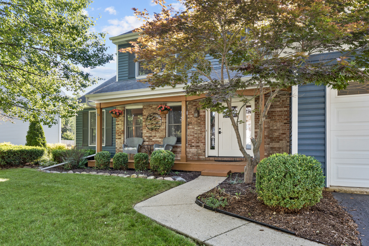2225 Forest Ridge Road St. Charles, IL 60174 - Photo 2 of 24 a front view of a house with garden